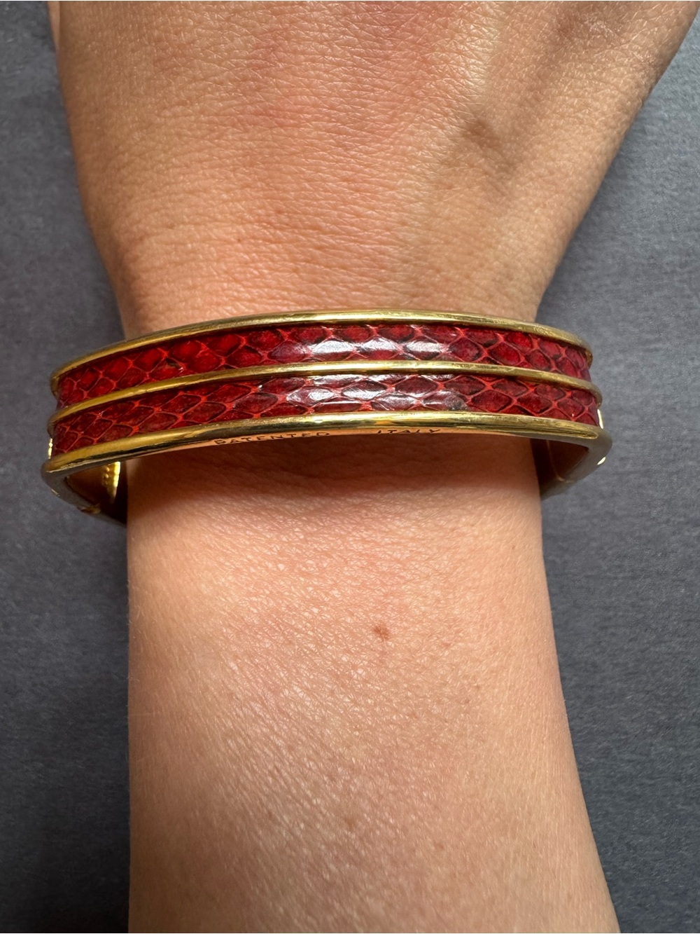 vintage gold-toned hinged bangle bracelet featuring a  snake  skininlay